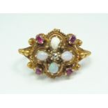 A Victorian Etruscan Revival opal, ruby and diamond ring, in a cannetille worked quatrefoil setting,