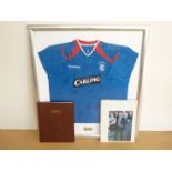 A signed Glasgow Rangers football shirt, together with a club history and signed photograph