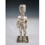 A silver model of a Guardsman in full dress, E & J, London, 1956, 177 g, 10 cm