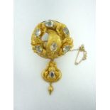 A substantial Victorian yellow metal and aquamarine pendant brooch, in the form of a convex