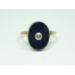 An 18ct gold, diamond and black onyx signet ring, the diamond brilliant being collet set and