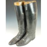 A pair of Victorian cavalry officer's boots with brass and wood trees, the latter engraved H W