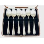 A cased set of six George III Old English pattern silver teaspoons, having shell form bowls and