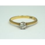 An 18ct gold and diamond solitaire ring, the brilliant of approximately .15ct claw set above a