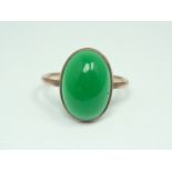 An early 20th Century 9ct gold and chrysoprase ring, the cabochon collet set above a fine shank