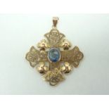 A 14ct gold and aquamarine cruciform pendant necklace, with central faceted oval stone,