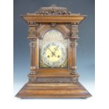 An imposing late 19th Century walnut mantel clock, having two-train movement striking on a coiled