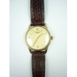 A 1950s Longines 9ct gold wrist watch, having calibre 12.68zs manual movement, the circular silvered