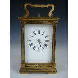 A late 19th / early 20th Century repeater carriage clock, in fancy corniche case, 14 cm high