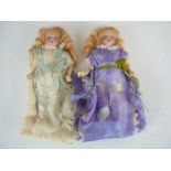 A pair of late Victorian / Edwardian pair of miniature bisque headed doll's house dolls, each having