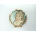 A 19th Century portrait miniature brooch, that of a young woman in water colour on ivory, in