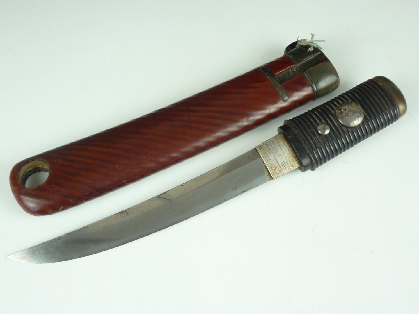 A Edo / Meiji Japanese hamidashi, the blade having a bevelled back edge and subtle hamon, with