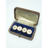 An early 20th Century gentleman's 9ct gold and mother-of-pearl cufflinks, each in the form of a