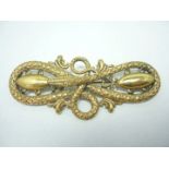A Victorian gilt brass brooch in the form of a coiled serpent, 9 cm