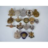 A quantity of military sweetheart brooches and lapel badges