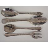 A pair of Victorian engraved electroplate sardine servers together with two preserve spoons