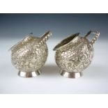 A pair of late 19th / early 20th Century Indian white metal salts, each of spherical form with