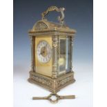 A late 19th Century French repeater carriage clock, having a concave silvered circular face with