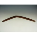 An antique Australian aboriginal boomerang, 65 cm