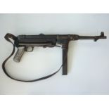 A deactivated 1943 German MP40 submachine gun, deactivated 1997, with sling
