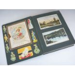 An early 20th Century photograph album containing approximately 96 postcards of a sentimental