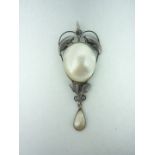 An early 20th Century Art Nouveau silver and blister pearl pendant necklace, the 18 mm pearl set