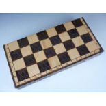 A 20th Century turned wooden chess set and combination box / board