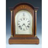 A late 19th Century mahogany cased table or mantel clock, having two-train movement with arched