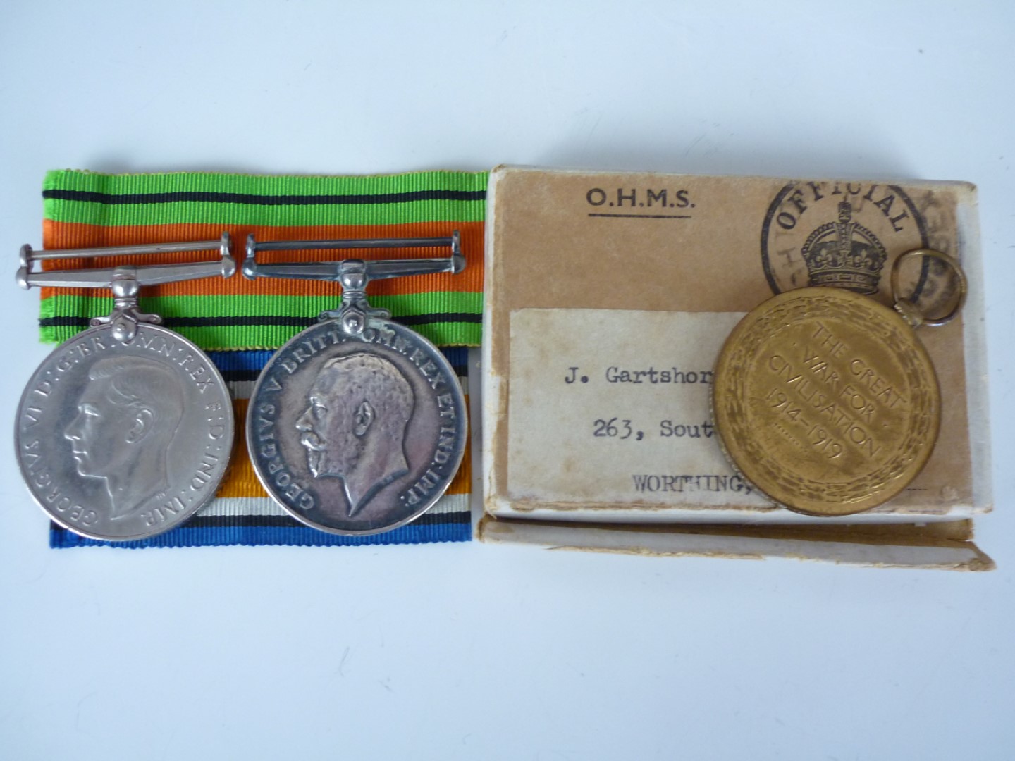 A British War and Allied Victory Medal pair to 33762 Pte J Gartshore, HLI, with issue carton and