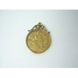 A 1906 gold half sovereign in a 9ct gold pendant mount