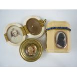 A George III ivory trinket box faced with silhouette portraits, of square section with canted