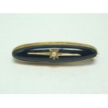 A Victorian yellow metal and French jet mourning brooch, of lenticular form, and faced with a