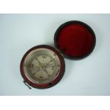 A late 19th / early 20th Century leather cased travelling pocket compass