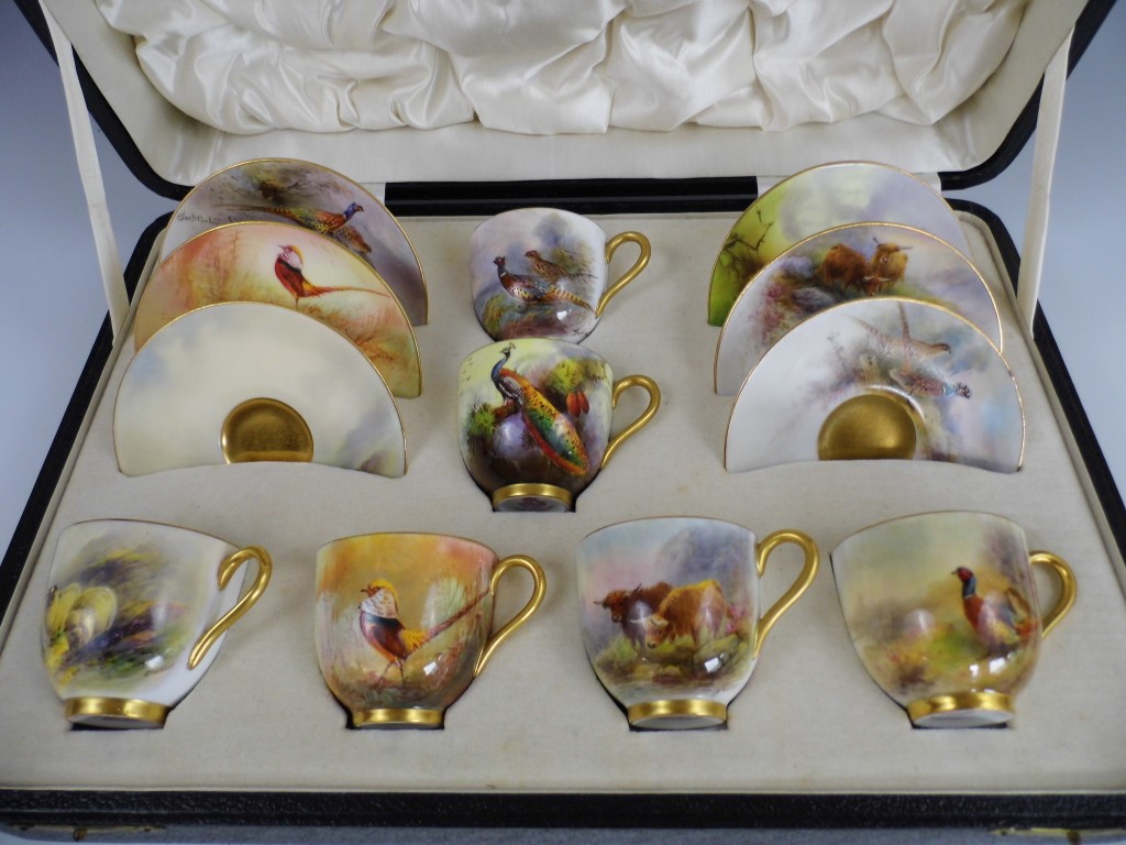 A cased 1920s Royal Worcester coffee service, comprising six cups and six saucers decorated in - Image 2 of 2