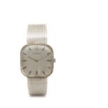 Reloj Juvenia de pulsera unisex. En oro blanco. Esfera argenté con numeración a trazos aplicados.