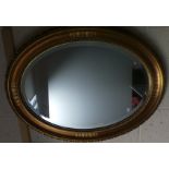 Oval bevelled glass wall mirror