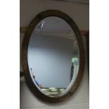 Oval framed bevelled edge mirror