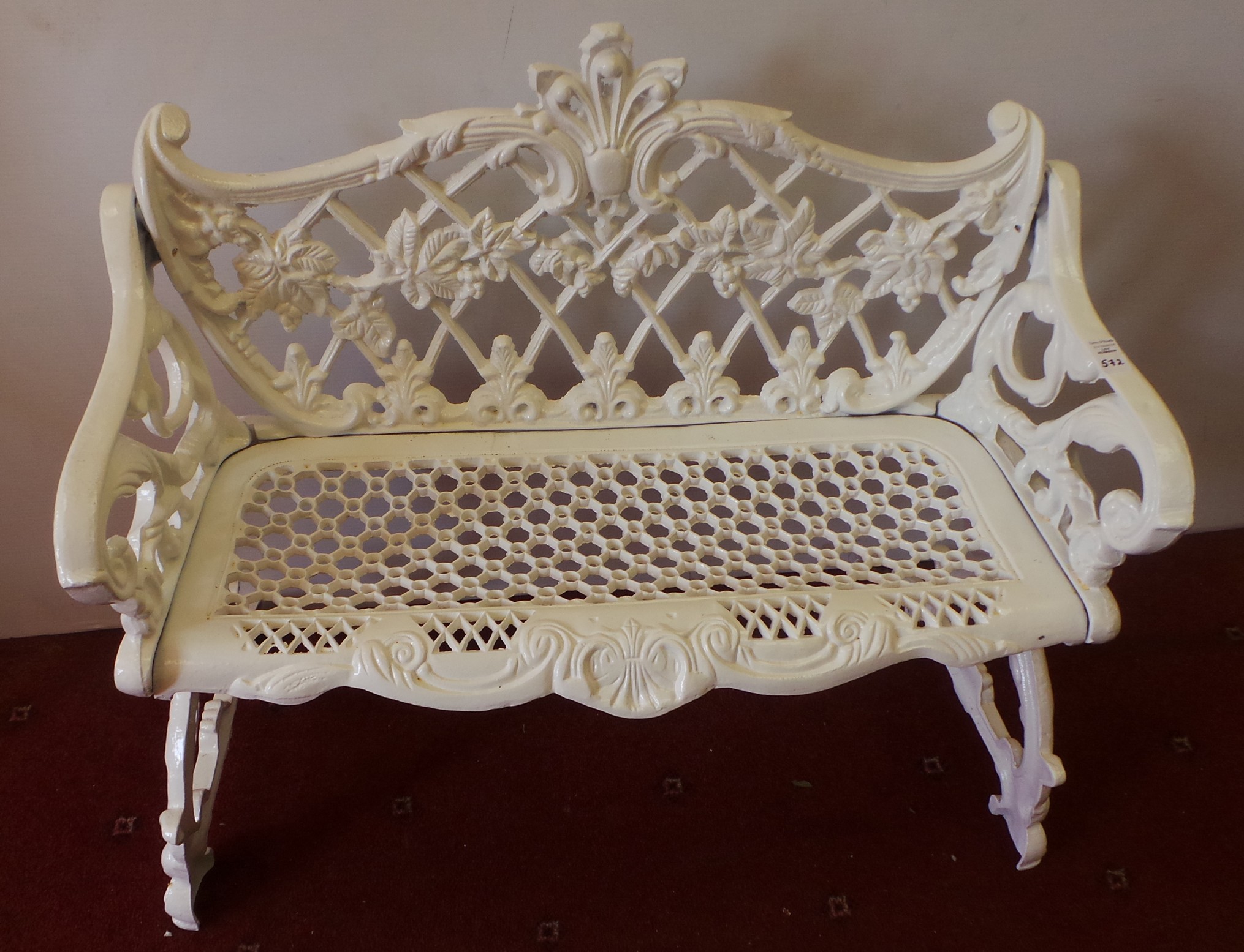 White cast iron two seater bench