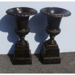 Pair of garden urns and bases in bronze finish