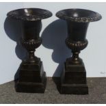 Pair of old copper finish garden urns and bases