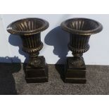 Pair of bronze finish garden urns and bases