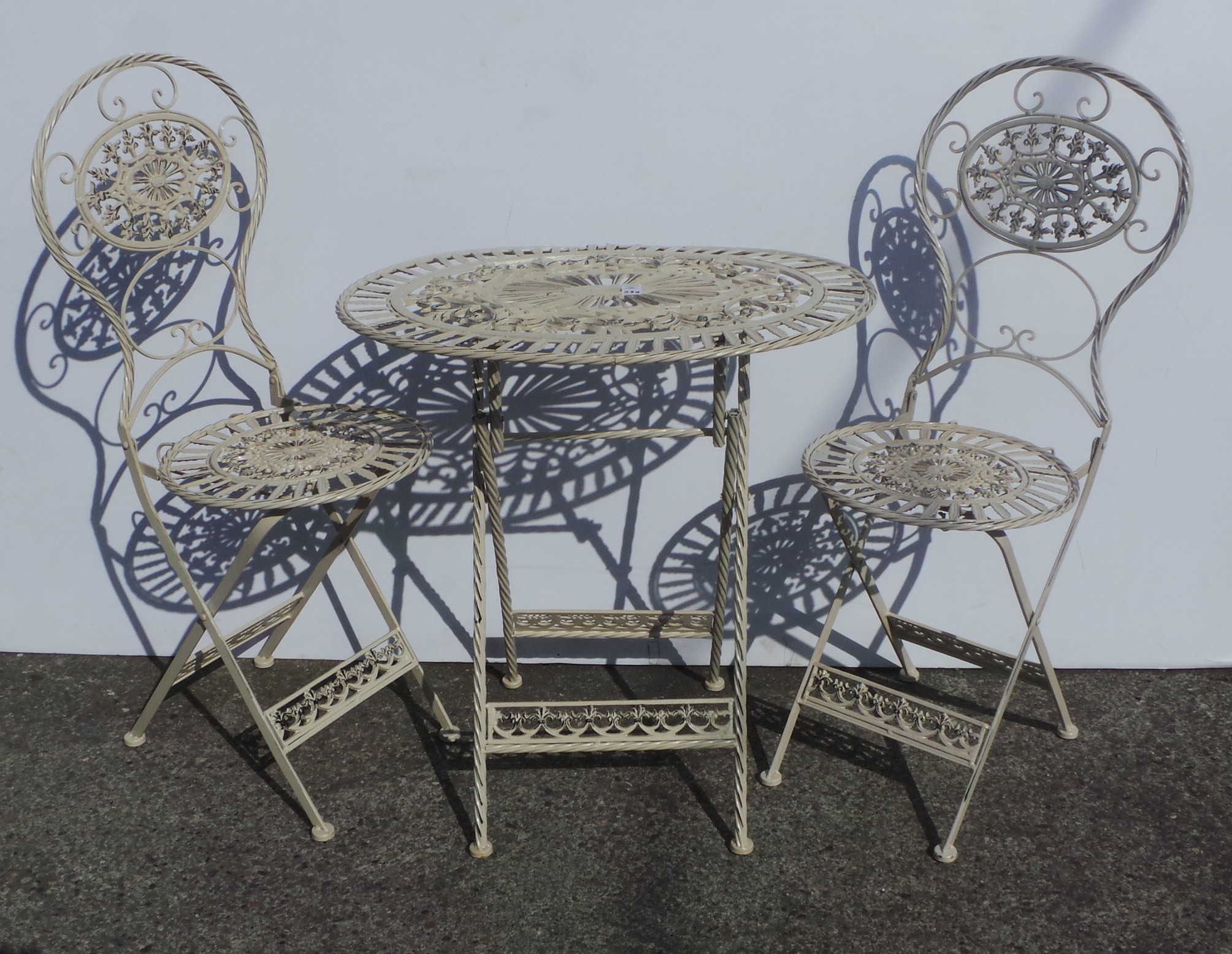 Oval table and two garden chairs