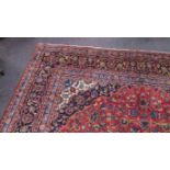 Hand-woven red ground Persian Kashan rug (4m x 2.95m)