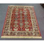 Red ground Kashmir rug  Aztec design (8ft x 5ft)