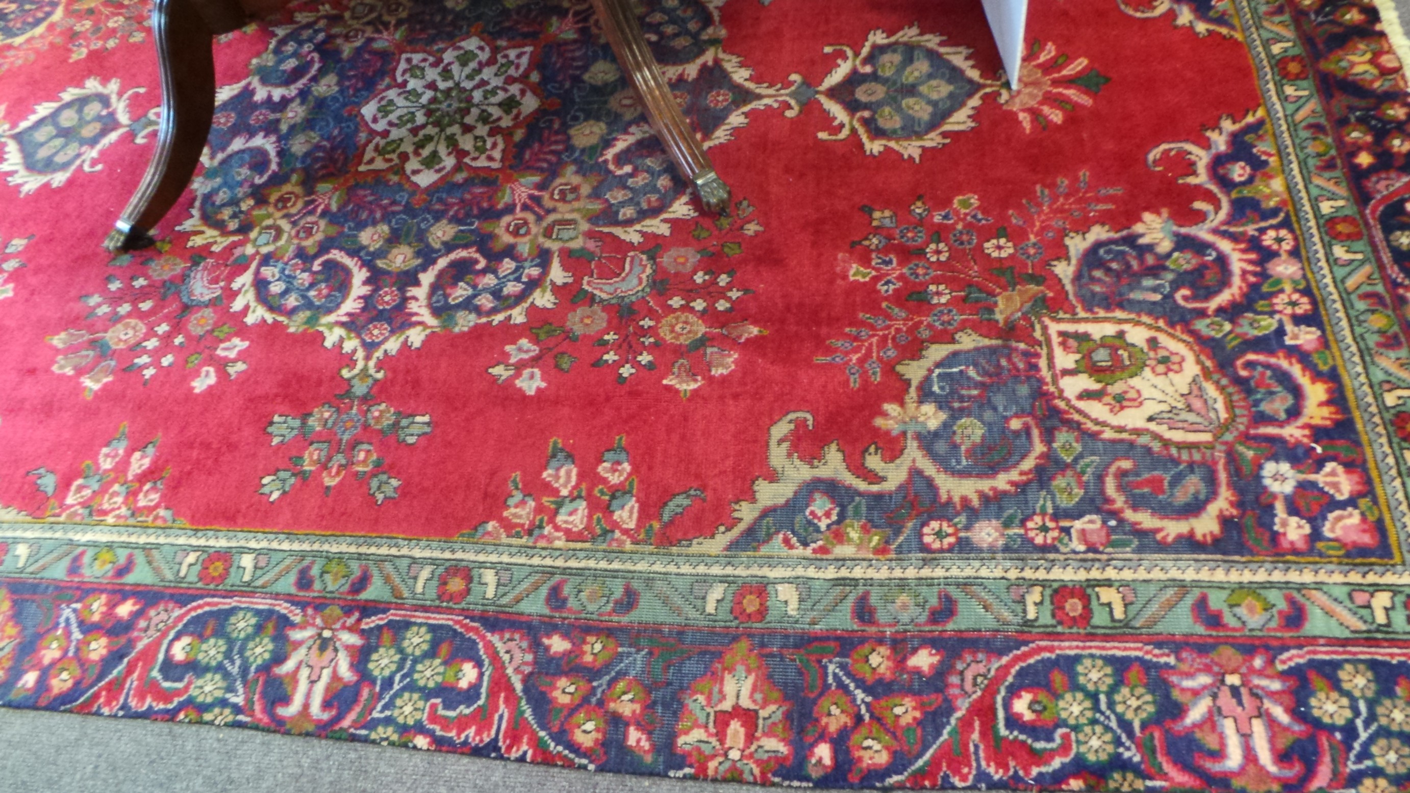 Hand-woven Persian Tabriz red ground rug (3.27m x 2.25m)