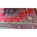 Hand-woven Persian Tabriz red ground rug (3.27m x 2.25m)