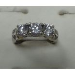 Brilliant cut diamond 3 stone ring (approx.: H/I colour, P1 Clarity, 2 caret, 14K band size N)