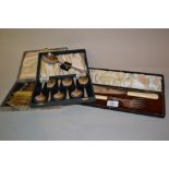 Cased pair of plated fish servers and tw