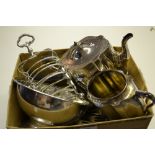 Two plated toast racks, teapot and sugar