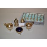 Five piece silver condiment set together